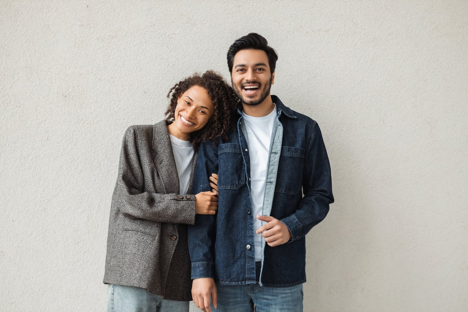 Cheerful couple embracing and smiling